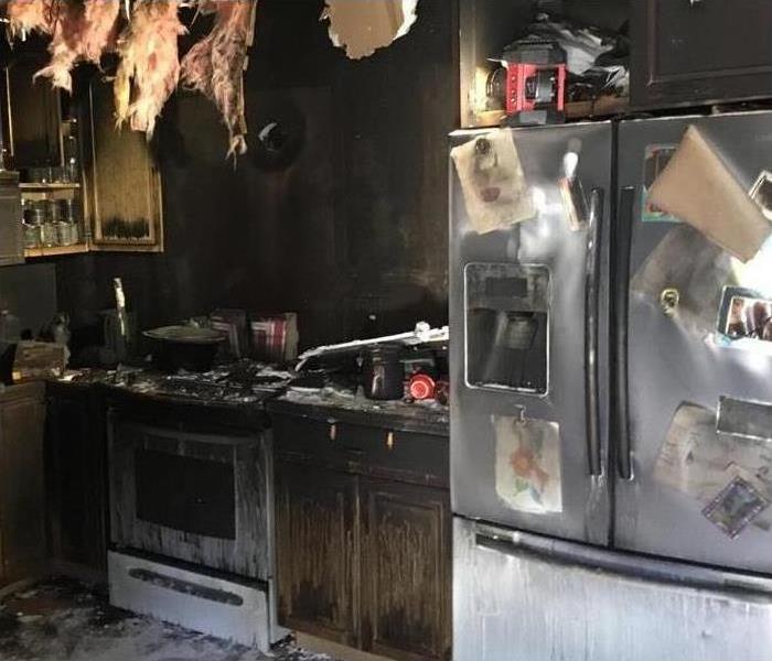 A Picture Of A Fire Damaged Kitchen Caused By Food On Stove