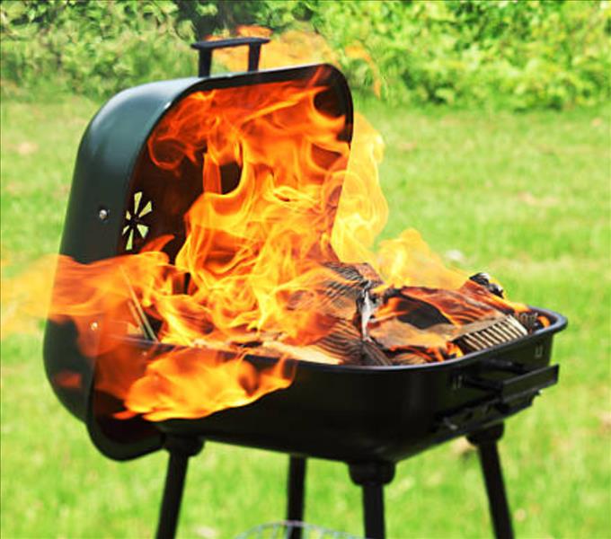 An Outdoor Grill On Fire